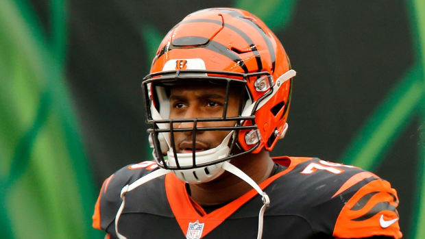 Cincinnati Bengals defensive tackle Mike Daniels (76) and Cincinnati Bengals defensive end Carlos Dunlap (96) take the field during introductions before the first quarter of the NFL Week 7 game between the Cincinnati Bengals and the Cleveland Browns at Paul Brown Stadium in downtown Cincinnati on Sunday, Oct. 25, 2020. The Bengals led 17-10 at halftime. Cleveland Browns At Cincinnati Bengals